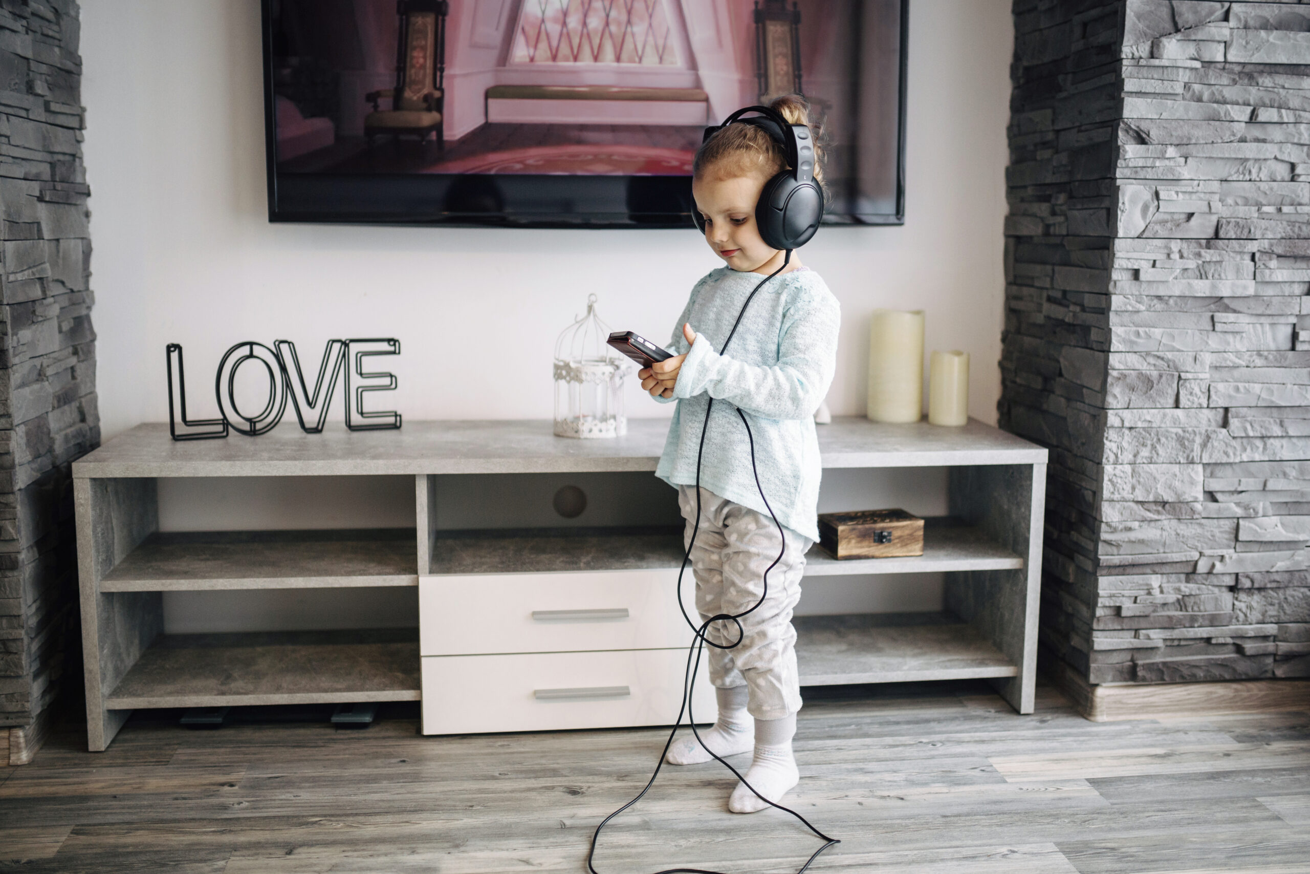 girl-listening-music-near-tv